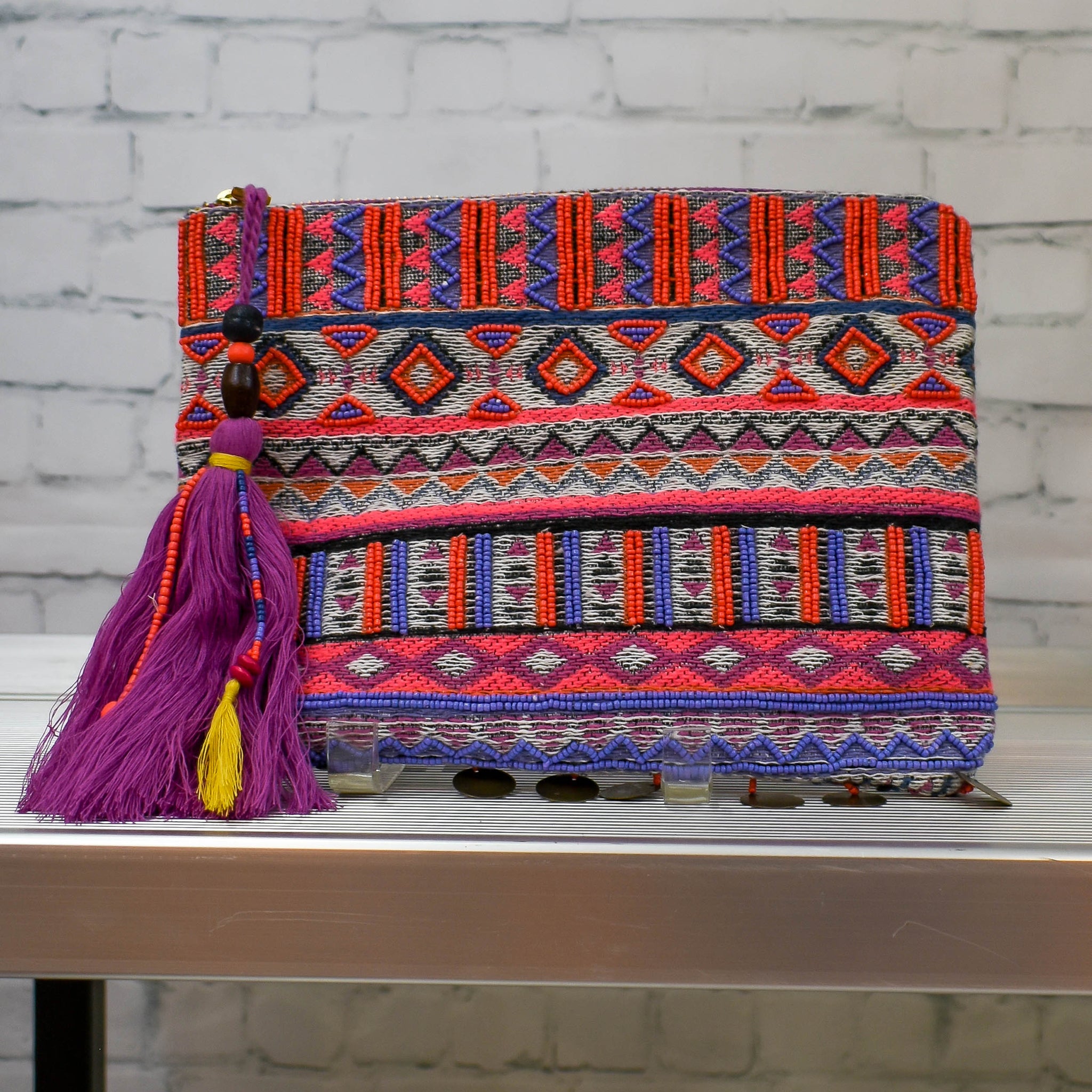 Fun and vibrant clutch with coin fringes